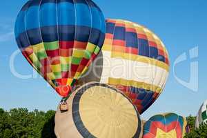 Colorful hot-air balloons ready to get up in flight