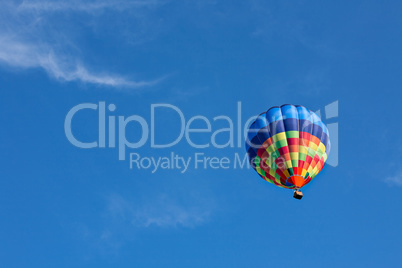 Colorful hot-air balloon in flight