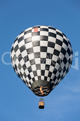 Black and white balloon in flight