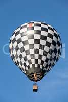 Black and white balloon in flight