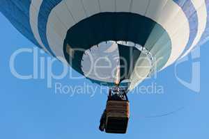 Colorful hot-air balloon is inflated for flight