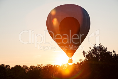 Hot-air balloon in silhouette ready to get up in flight