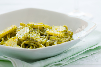 Closeup of linguine pasta with pesto genovese and potatoes
