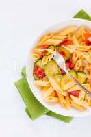 Italian penne pasta with zucchini and cherry tomatoes