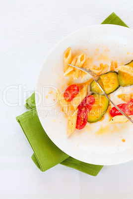 Italian penne pasta with zucchini and cherry tomatoes