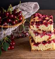 stack of square slices of a baked pie with cherry berries