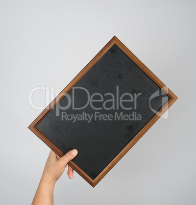 hand holding an empty chalk frame