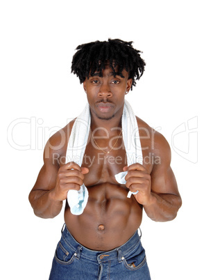 A bodybuilder black man standing shirtless with a towel