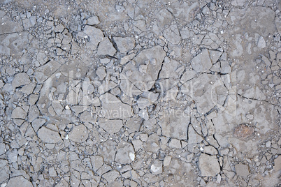fragment of gray cracked cement floor