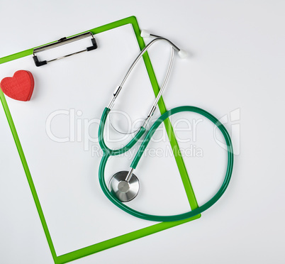 empty white sheets and a medical stethoscope