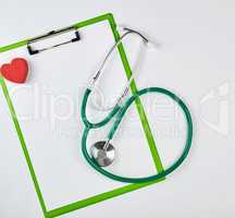 empty white sheets and a medical stethoscope