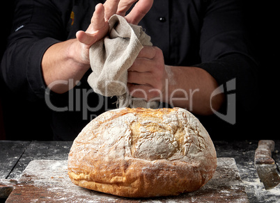 baked round bread on a board