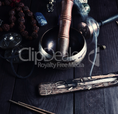 copper singing bowl and a wooden stick