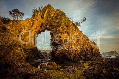 A Natural Arch on the Coast at Golden Hour