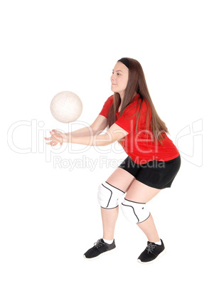 Young girl playing volley ball
