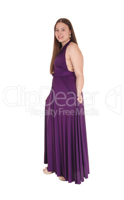 Teenager girl standing in her prom dress