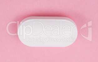 White Pill on Pink Background