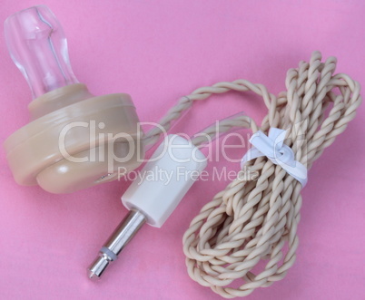 Plastic Headphones on Pink Background