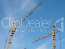 two crane towers on sky background