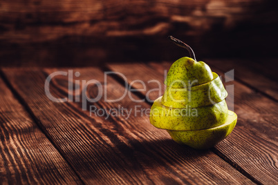 Sliced Pear on Wooden Background.
