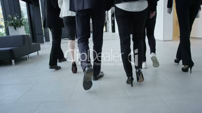 Business people walking in hall