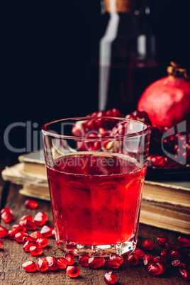 Drinking glass of pomegranate cocktail