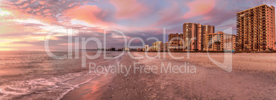 Pink and gold sunset sky over South Marco Island Beach