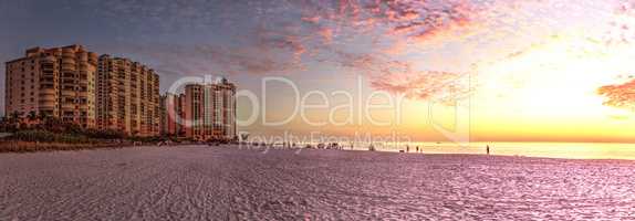 Pink and gold sunset sky over South Marco Island Beach