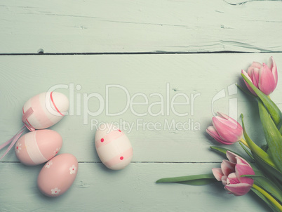 Three pink tulips with Easter decoration