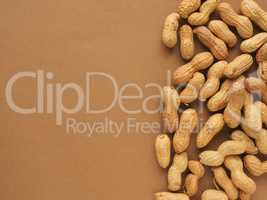Organic peanuts on a brown background