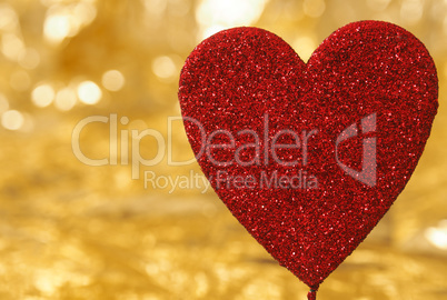 Big red heart on a golden background