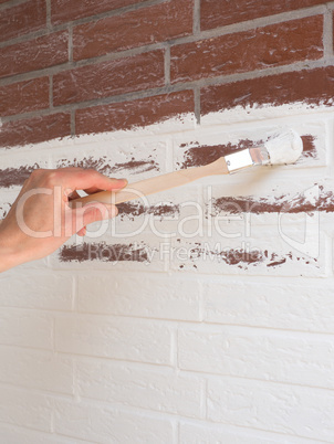 Coloring a wall with white paint