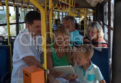 A joyful family in a bus