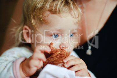 Blue eyes of a croissant eater