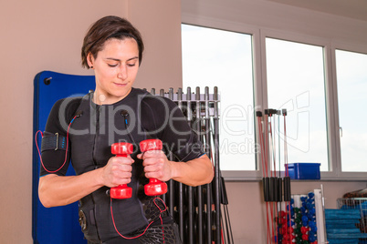 girl exercising with dumbells