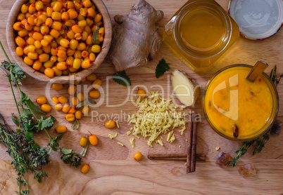 ingredients for cocktail recipe with sea buckthorn and honey
