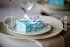 Light blue gift box on the plate