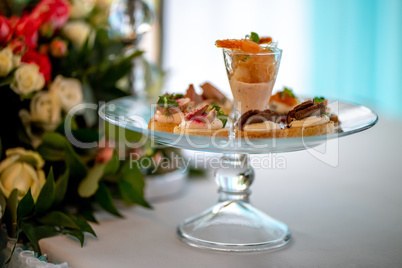 Shrimp salad and sandwiches on plate.