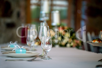 Glasses and gift boxes on the table