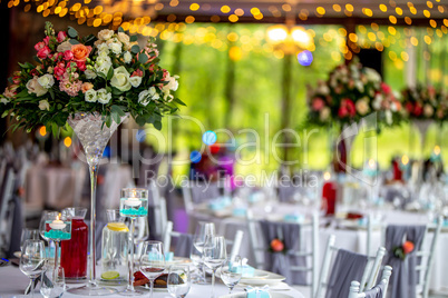 Wedding table decorated with flowers and dishes
