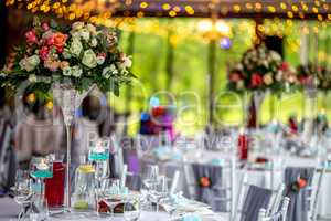 Wedding table decorated with flowers and dishes