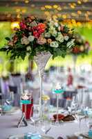 Wedding table decorated with flowers and dishes