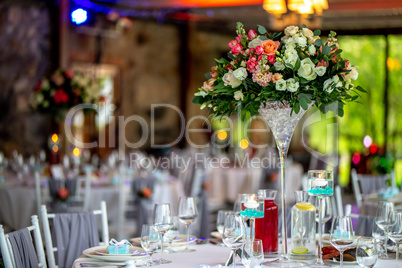 Wedding table decorated with flowers and dishes
