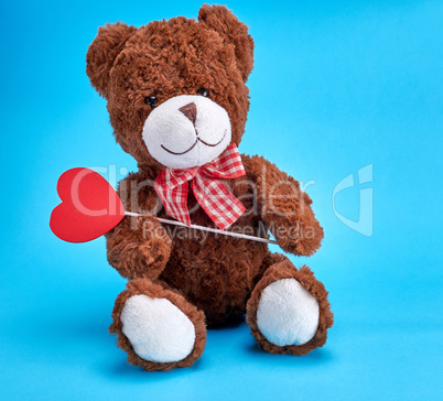 vintage brown teddy bear on blue background