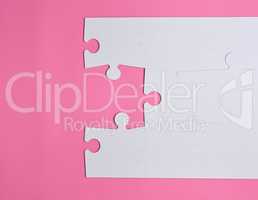 white large blank puzzles on a pink background