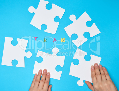 white big puzzles on a blue background,  inscription team, conce