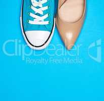blue sports shoes and beige shoes
