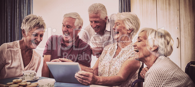 Group of seniors using digital tablet