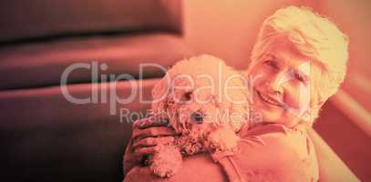 Senior woman holding a dog