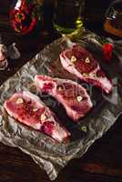 Raw Steaks with Chili Pepper and Garlic